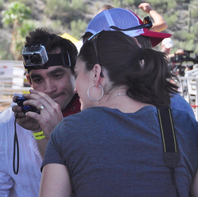 runners looking at pictures taken of themselves